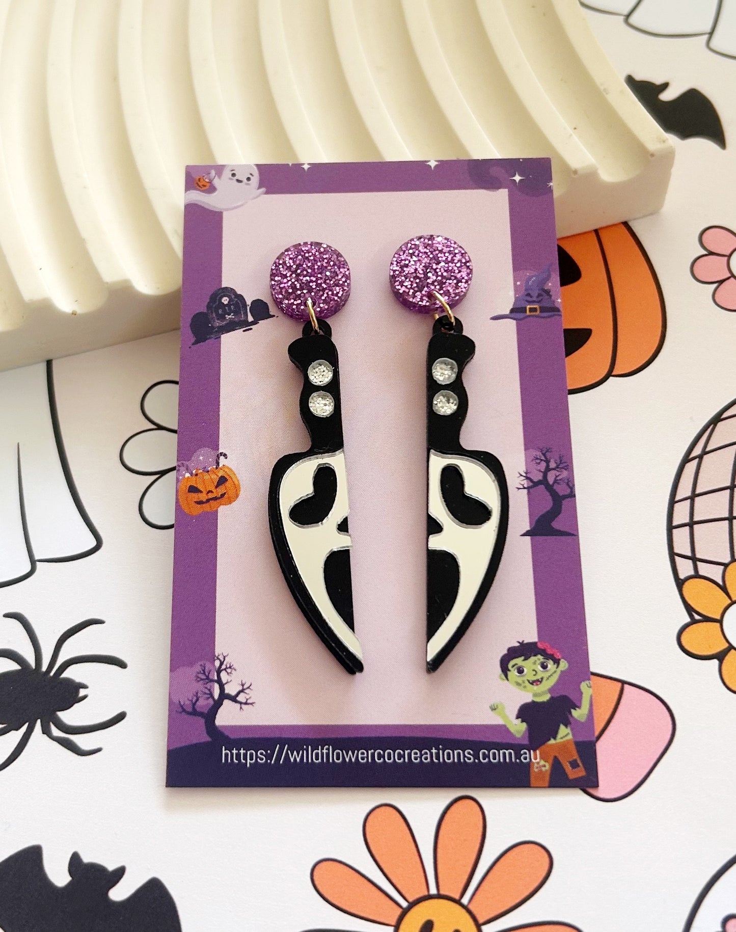 Ghost face knife dangles